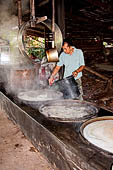 Thai traditional house. The making of sugar from coconut . 